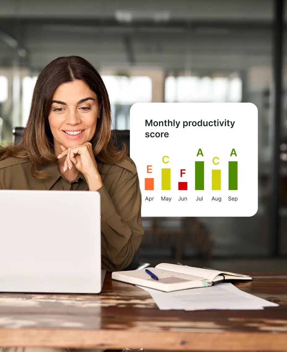 Woman reviewing productivity reports on a laptop – monitor performance and worktime tracking in fleet operations