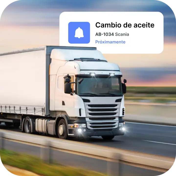 Camión Scania blanco circulando por la autopista al atardecer con una alerta digital superpuesta que dice «Cambio de aceite, AB-1034 Scania, próximo vencimiento».