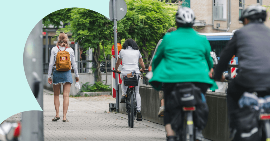 People walking and riding bikes to avoid traffic jams.