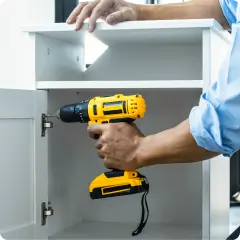 Technician assembling furniture – mobile worktime tracking for service and maintenance teams